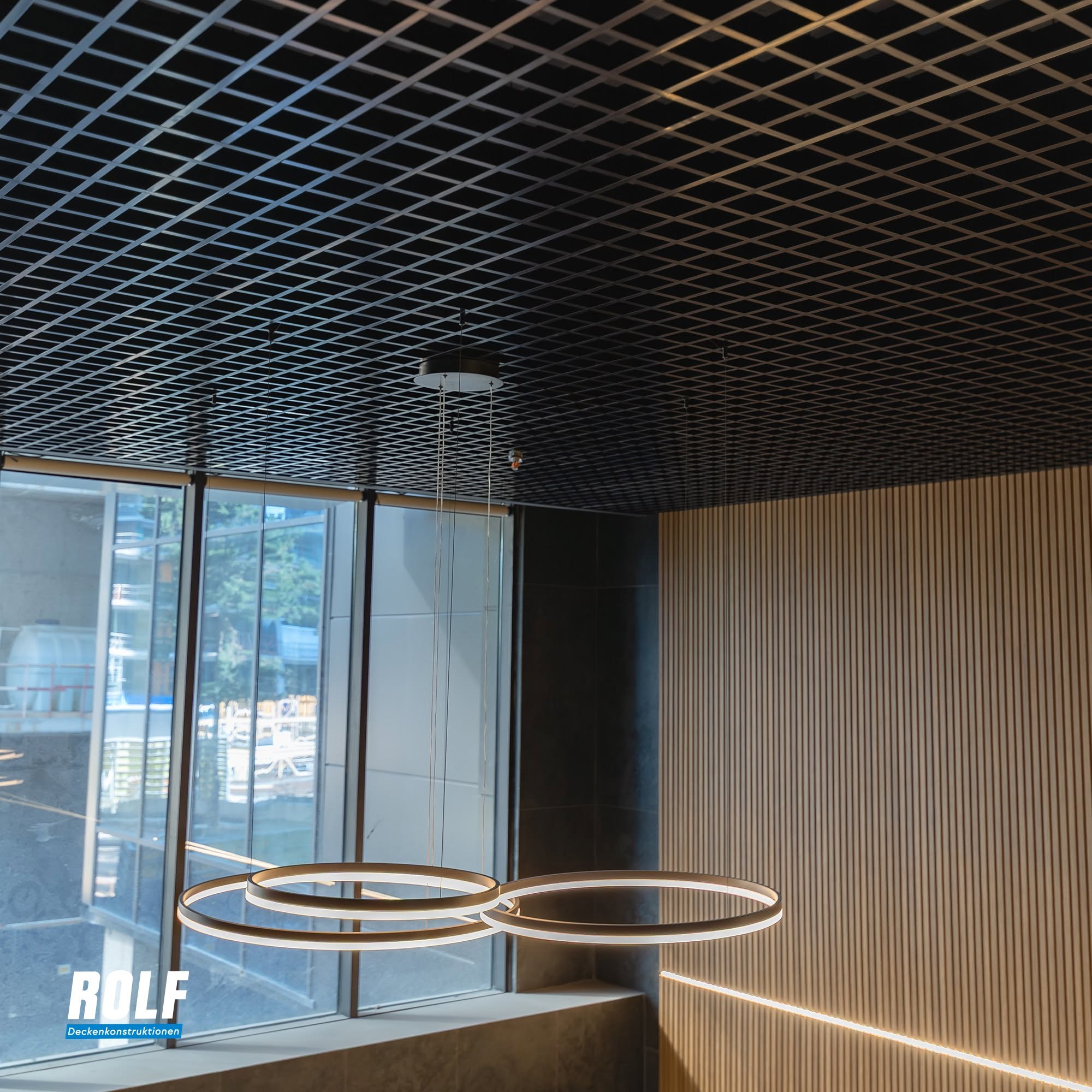 Modern interior with grid ceiling design.