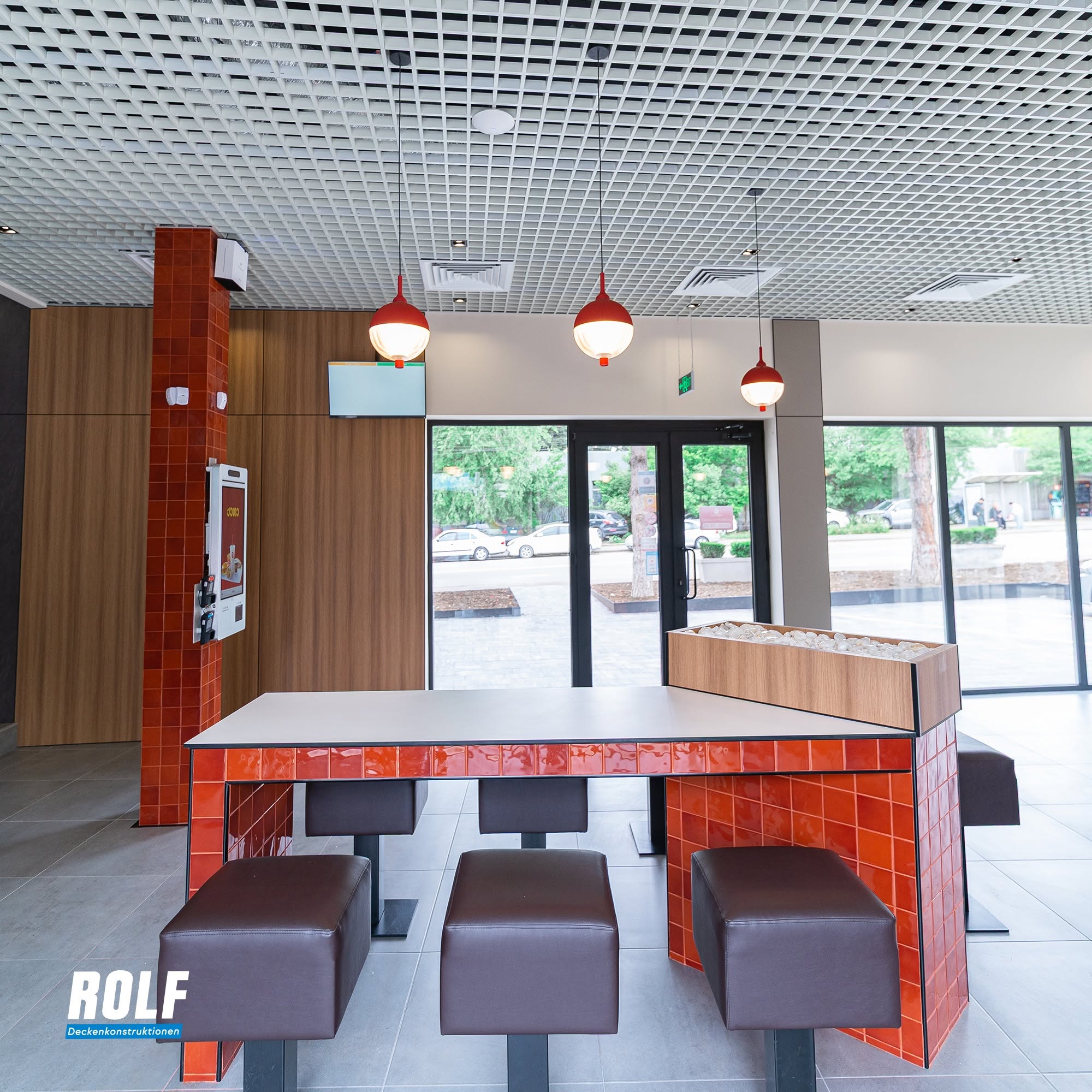 Modern restaurant interior with grid ceiling
